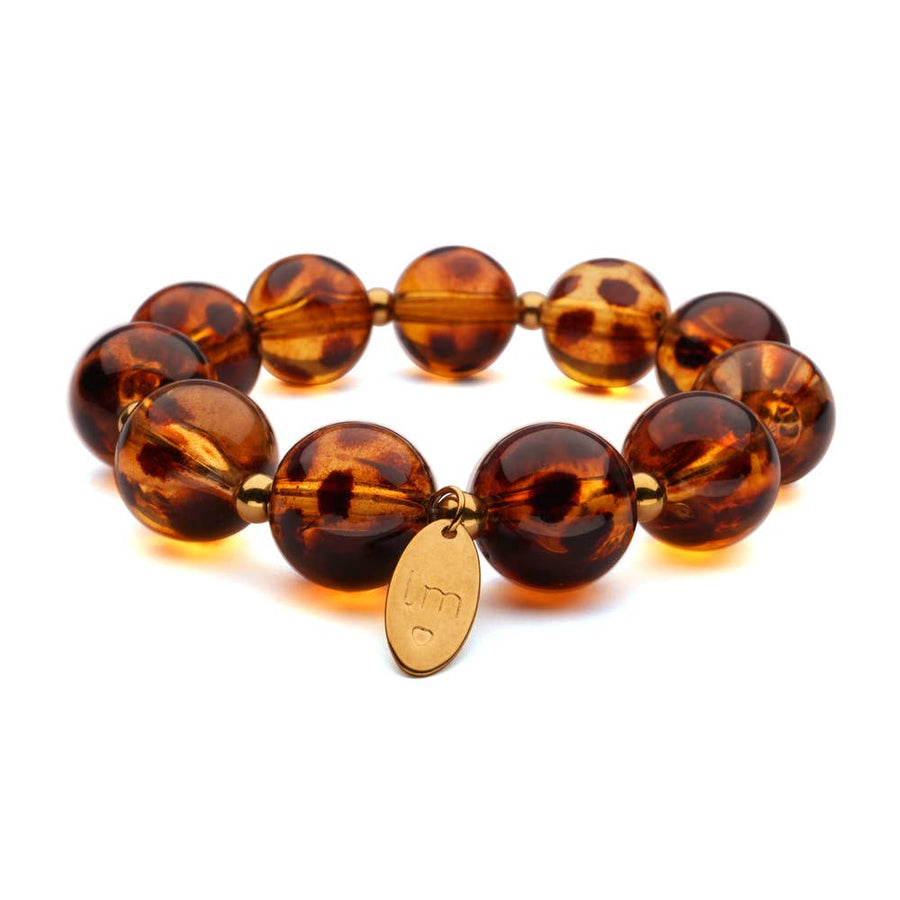Bracelet perles écaille ambrée avec breloque