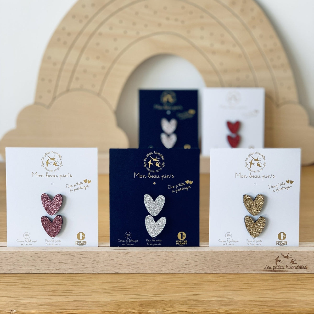Pin's enfant cœurs à partager doré – les petites hirondelles